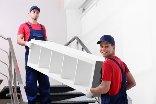 Local moving team preparing boxes for a Battersea apartment relocation