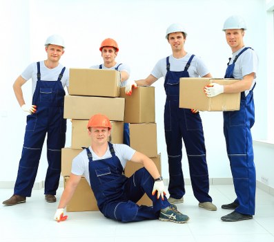 Loading furniture and boxes into a moving truck in Battersea