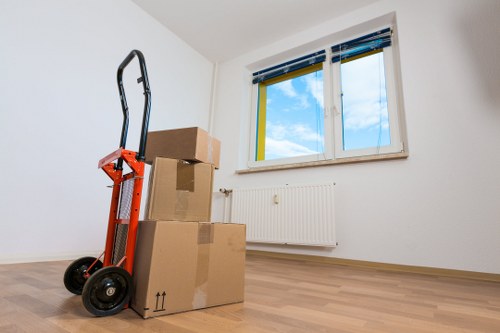 Professional piano removals service unloading an instrument at a Battersea property