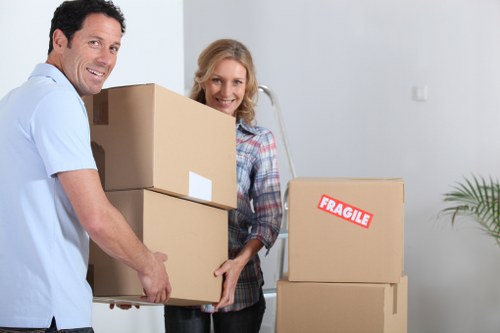 Professional removals team handling a flat move in Battersea with narrow stair access