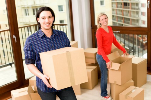 Professional packers organising fragile household items in Battersea