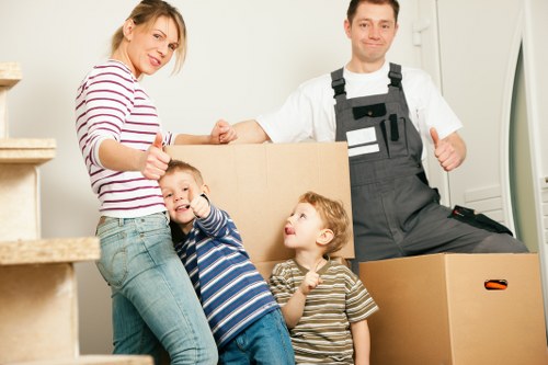 Careful loading of boxes and furniture into a removals van